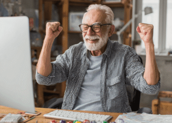 Older man excited playing online bingo