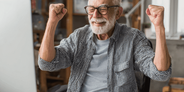 Older man excited playing online bingo